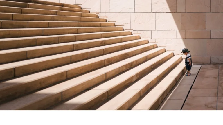 Advert with small penguin figurine on large stairway, text about choosing a philanthropic partner.