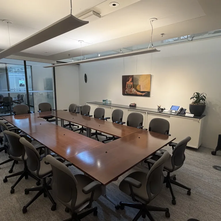 Image of MCF Oak room. Image contains long table with chairs around it.