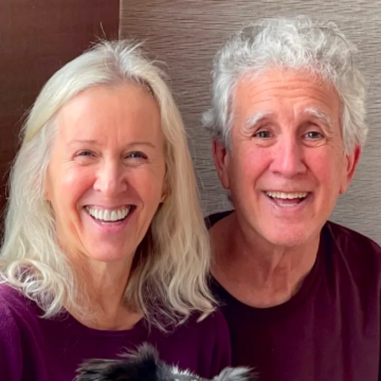 Older woman and man smiling headshot