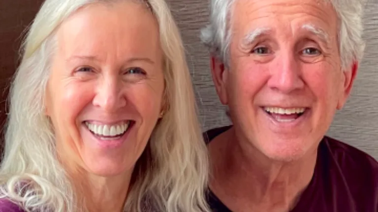 Older man and woman couple smiling headshot