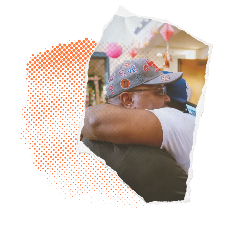 Person wearing a hat with a festive background, image partially overlaid with orange halftone.