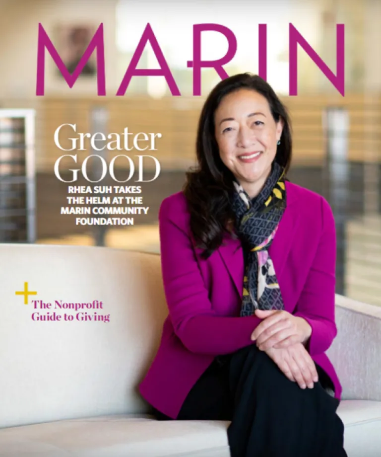 Rhea Suh on the cover of Marin Magazine sitting on a sofa