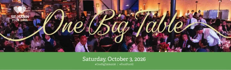 Image of One Big Table Sign, with a lot of people on the background sitting on tables