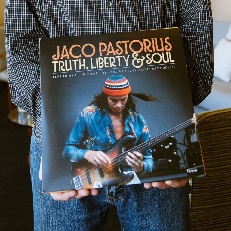 Mike Anguera holding Jaco Pastorius' Truth, Liberty & Soul vinyl album