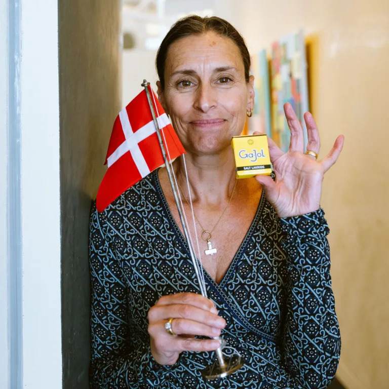 Safia Kryger-Nelson holding flag