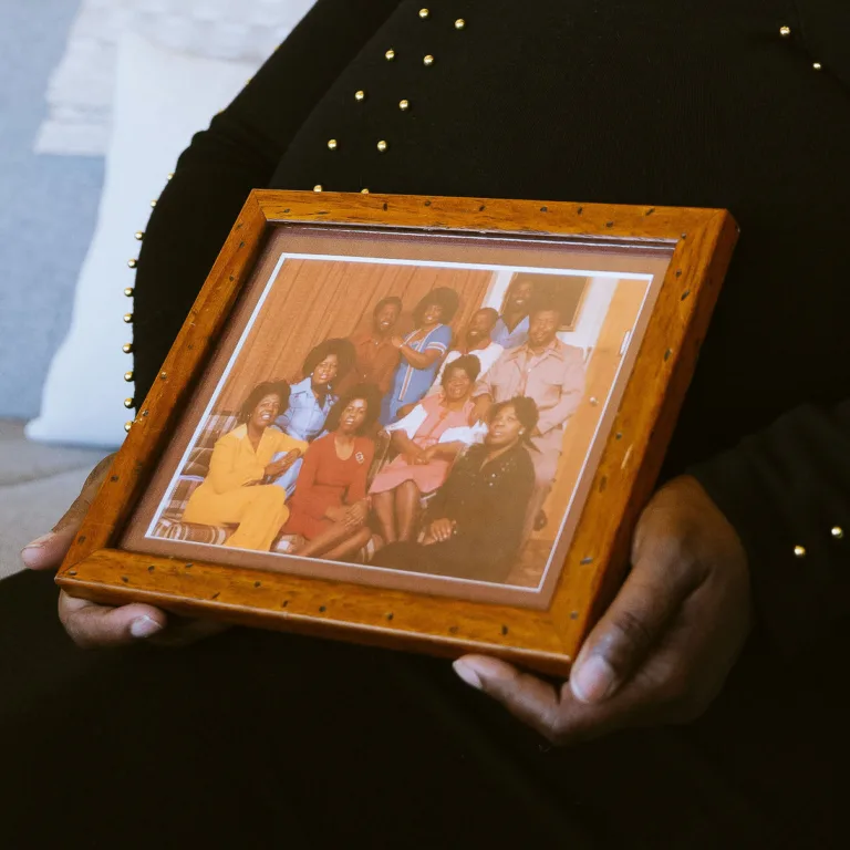 Lenic Smith holding an old family photo