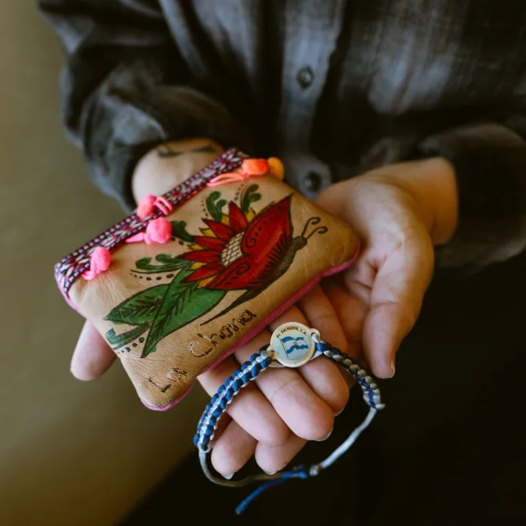 Maria Elena Valle holding bracelet and coin purse