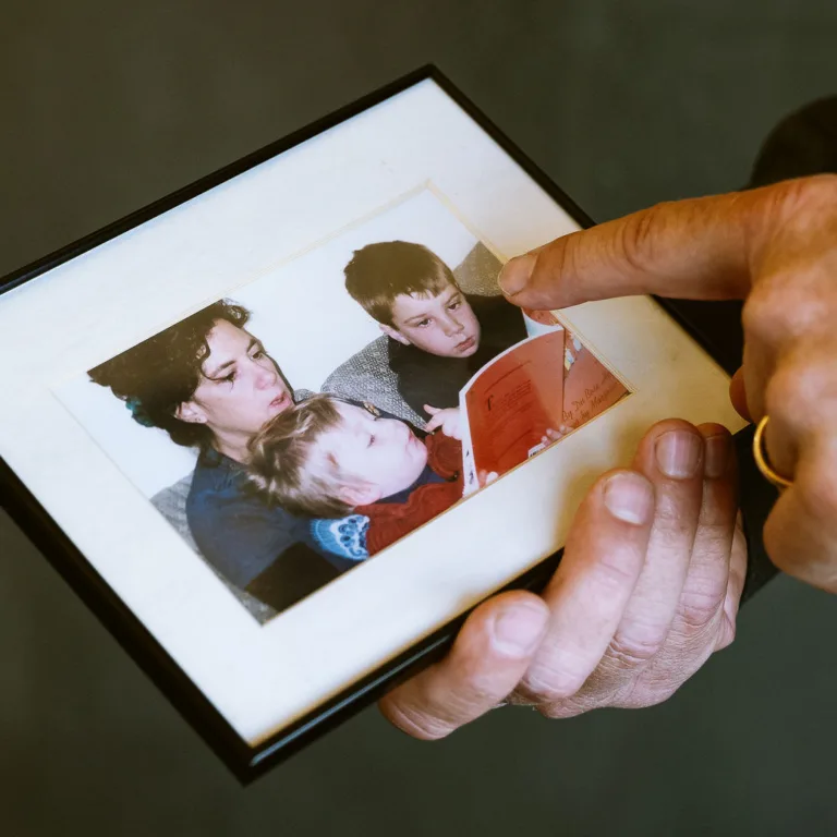 Ralph Lewin holding old family photo