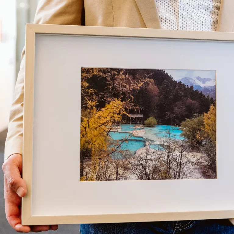 Edward Wang holding portrait