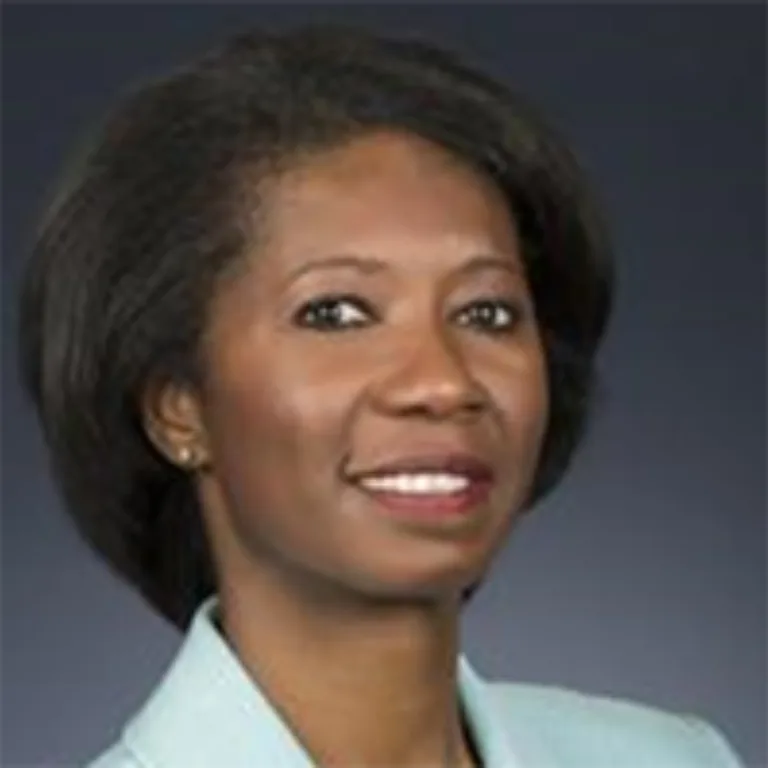 Headshot of Nichole Walker wearing a light green blazer